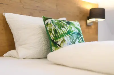 Ein Bett oder Betten in einem Zimmer der Unterkunft Zum Scheffelhof