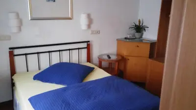 Ein Bett oder Betten in einem Zimmer der Unterkunft Hessisches Haus