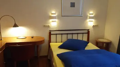 Ein Bett oder Betten in einem Zimmer der Unterkunft Hessisches Haus