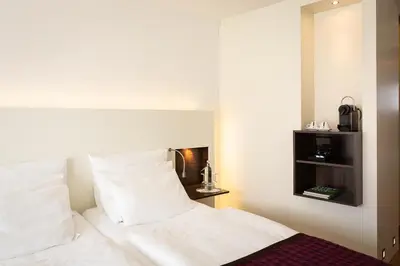 Ein Bett oder Betten in einem Zimmer der Unterkunft Bergheim 41 Hotel im Alten Hallenbad