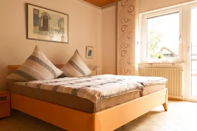 Ein Bett oder Betten in einem Zimmer der Unterkunft Apartment Muggensturm am Badesee