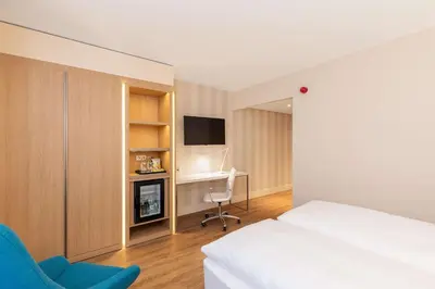 Ein Bett oder Betten in einem Zimmer der Unterkunft NH Mannheim