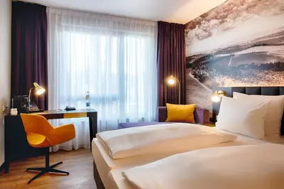 Ein Bett oder Betten in einem Zimmer der Unterkunft Welcome Hotel Neckarsulm