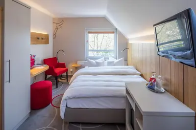 Ein Bett oder Betten in einem Zimmer der Unterkunft Hotel Zum Goldenen Ochsen am Schlossgarten
