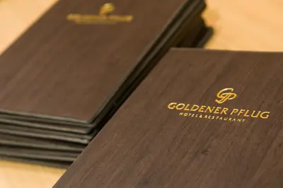 Ein Zertifikat, Auszeichnung, Logo oder anderes Dokument, das in der Unterkunft Hotel & Restaurant Goldener Pflug ausgestellt ist