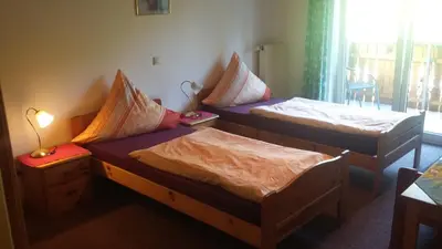 Ein Bett oder Betten in einem Zimmer der Unterkunft Gästehaus Rüger