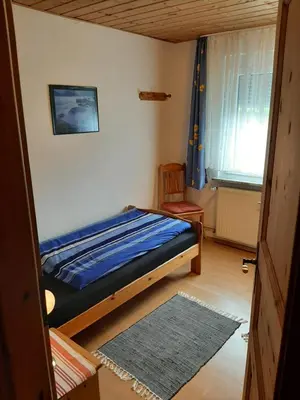 Ein Bett oder Betten in einem Zimmer der Unterkunft Gästehaus Rüger