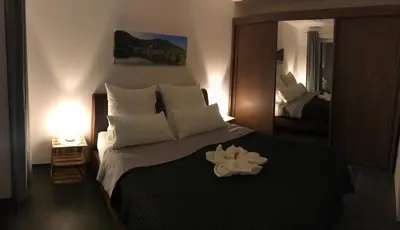 Ein Bett oder Betten in einem Zimmer der Unterkunft Main Boarding House