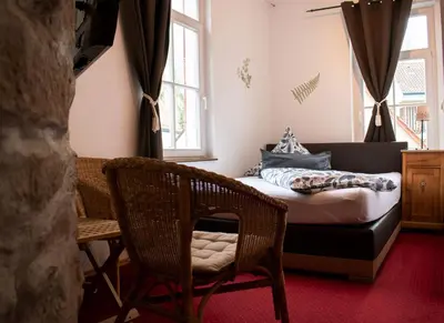 Ein Bett oder Betten in einem Zimmer der Unterkunft Hotel Herberge zur Traube