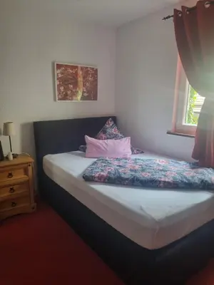 Ein Bett oder Betten in einem Zimmer der Unterkunft Hotel Herberge zur Traube