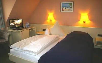 Ein Bett oder Betten in einem Zimmer der Unterkunft Zum treuen Bartel