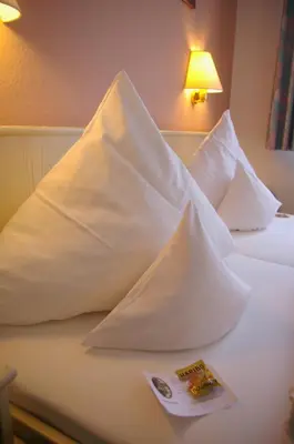 Ein Bett oder Betten in einem Zimmer der Unterkunft Zum treuen Bartel