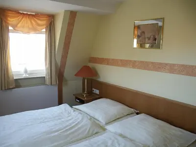 Ein Bett oder Betten in einem Zimmer der Unterkunft Restaurant Orakel