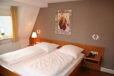 Ein Bett oder Betten in einem Zimmer der Unterkunft Restaurant Orakel