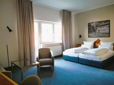 Ein Bett oder Betten in einem Zimmer der Unterkunft Hotel Württemberger Hof