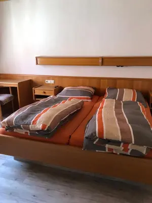 Ein Bett oder Betten in einem Zimmer der Unterkunft Darmstädter Hof