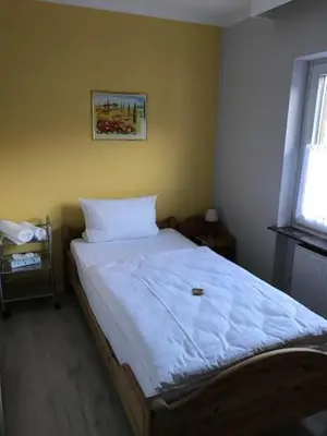 Ein Bett oder Betten in einem Zimmer der Unterkunft Hotel zum Ochsen