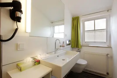 Ein Badezimmer in der Unterkunft Hotel Restaurant Reichsadler