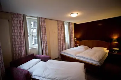 Ein Bett oder Betten in einem Zimmer der Unterkunft Hotel Karpfen