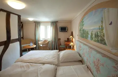 Ein Bett oder Betten in einem Zimmer der Unterkunft Hotel Karpfen