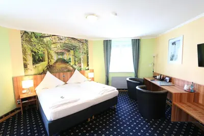 Ein Bett oder Betten in einem Zimmer der Unterkunft Hotel Deutscher Hof