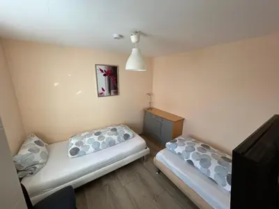 Ein Bett oder Betten in einem Zimmer der Unterkunft Exclusiv Apartment 3 Zi Waschmaschine