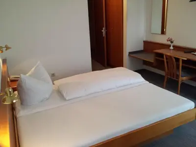Ein Bett oder Betten in einem Zimmer der Unterkunft Hotel am Exerzierplatz