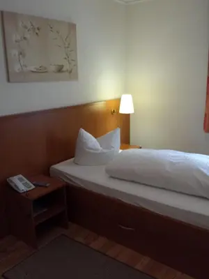 Ein Bett oder Betten in einem Zimmer der Unterkunft Hotel am Exerzierplatz