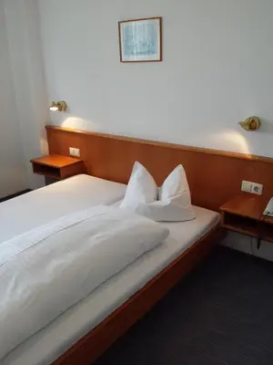 Ein Bett oder Betten in einem Zimmer der Unterkunft Hotel am Exerzierplatz