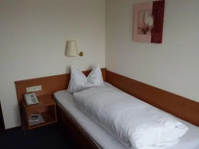 Ein Bett oder Betten in einem Zimmer der Unterkunft Hotel am Exerzierplatz