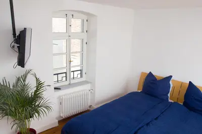 Ein Bett oder Betten in einem Zimmer der Unterkunft Gästezimmer Mittelgasse