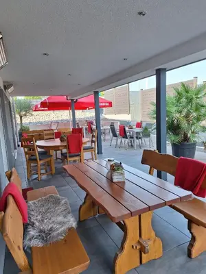 Ein Sitzbereich in der Unterkunft Hotel Hohenloher Tor
