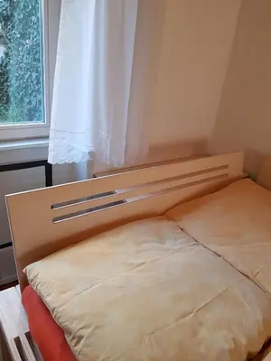 Ein Bett oder Betten in einem Zimmer der Unterkunft Zwischen-Rhein-und-Reben, zentral, barrierefrei