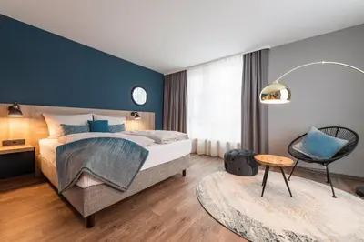Ein Bett oder Betten in einem Zimmer der Unterkunft HARBR Hotel Heilbronn, a member of Radisson Individuals