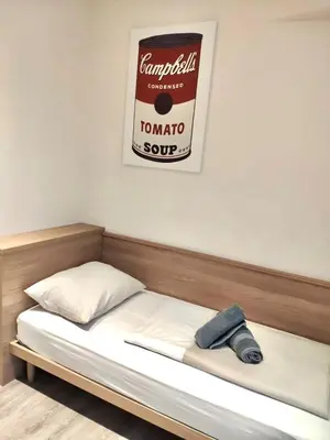 Ein Bett oder Betten in einem Zimmer der Unterkunft Kriemhilde Dependance