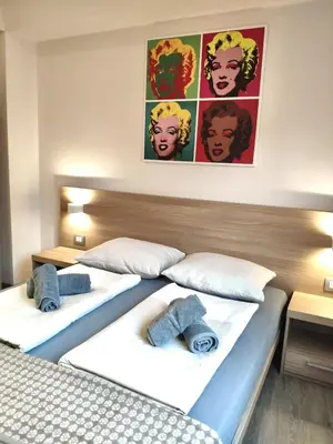 Ein Bett oder Betten in einem Zimmer der Unterkunft Kriemhilde Dependance