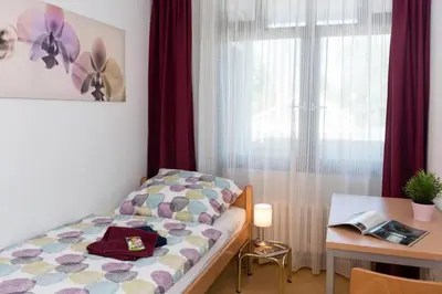 Ein Bett oder Betten in einem Zimmer der Unterkunft Talblick Appartement in traumhafter Lage!