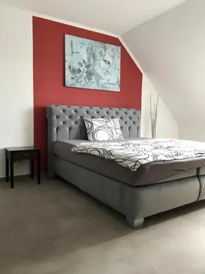 Ein Bett oder Betten in einem Zimmer der Unterkunft Hotel Maxdorfer Hof