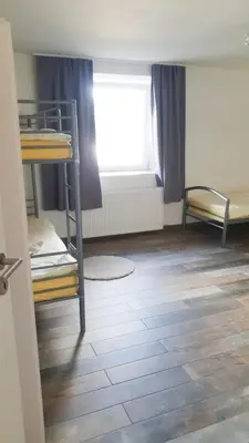 Ein Bett oder Betten in einem Zimmer der Unterkunft Villa Birkenfeld