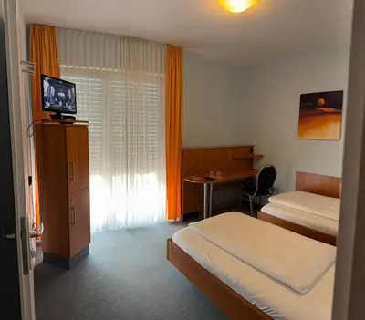 Ein Bett oder Betten in einem Zimmer der Unterkunft SVG Hotel Diversi