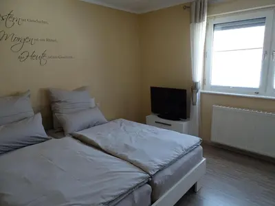 Ein Bett oder Betten in einem Zimmer der Unterkunft Ferienhaus Fam. Bisgen