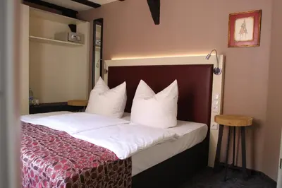 Ein Bett oder Betten in einem Zimmer der Unterkunft Hotel Schmuckkästchen
