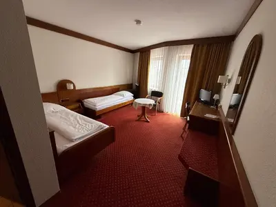 Ein Bett oder Betten in einem Zimmer der Unterkunft Hotel Post Viernheim
