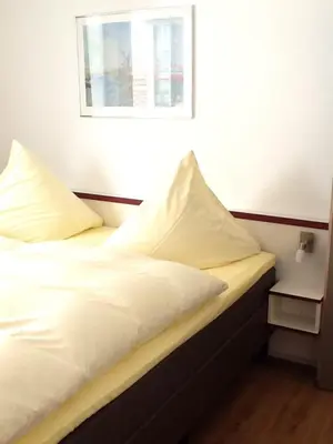 Ein Bett oder Betten in einem Zimmer der Unterkunft Hotel Adler