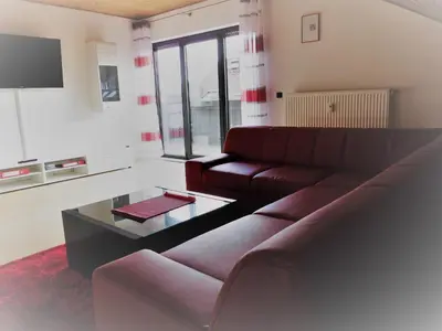 Ein Sitzbereich in der Unterkunft Ferienwohnung-Fuchs