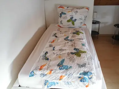Ein Bett oder Betten in einem Zimmer der Unterkunft Ferienwohnung-Fuchs