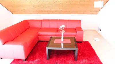 Ein Sitzbereich in der Unterkunft Ferienwohnung-Fuchs