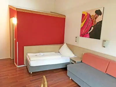 Ein Bett oder Betten in einem Zimmer der Unterkunft Brau Art Hotel
