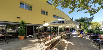 Ein Restaurant oder anderes Speiselokal in der Unterkunft Brau Art Hotel