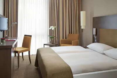 Ein Bett oder Betten in einem Zimmer der Unterkunft IntercityHotel Darmstadt